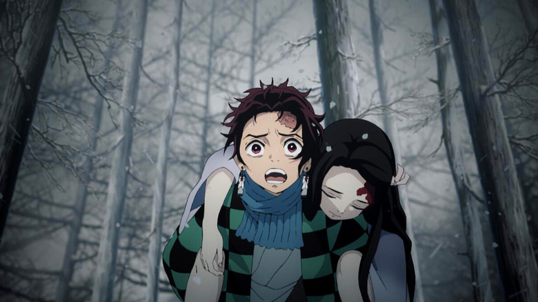 Tanjiro carrying Nezuko Kamado