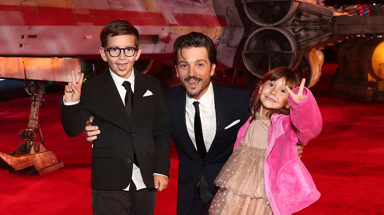 Diego Luna and kids in front of x-wing