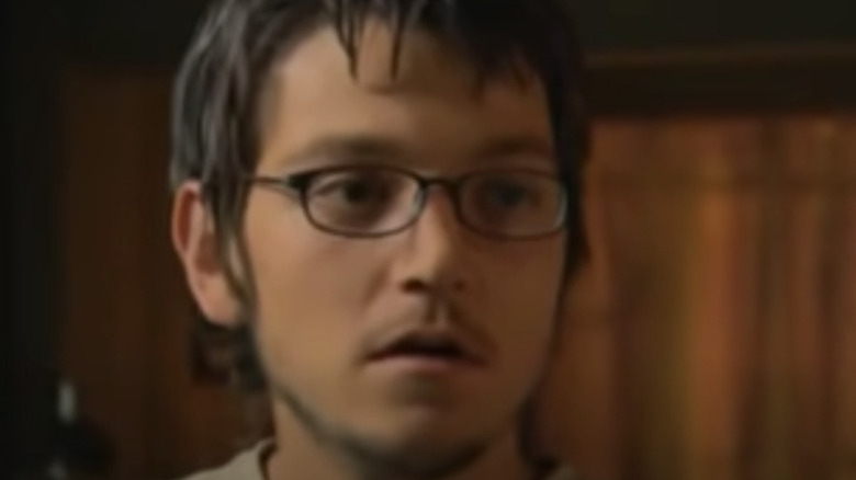 Diego Luna in glasses and dark room