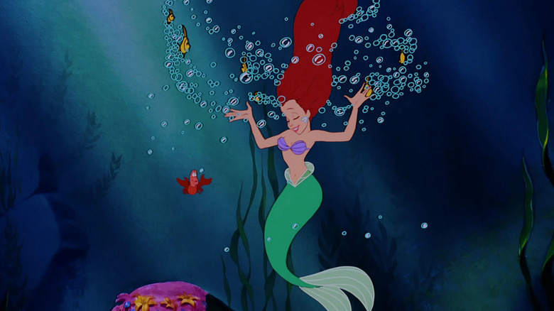 Sebastian and Ariel dancing underwater