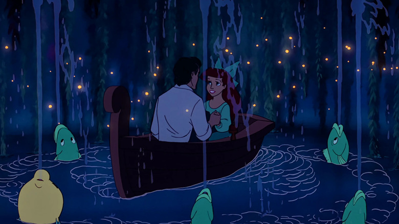 Eric and Ariel sit in boat