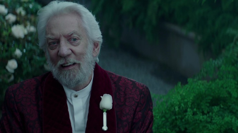 President Snow grinning in his greenhouse