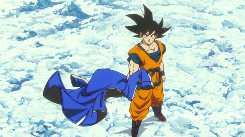 Goku standing and challenging Broly