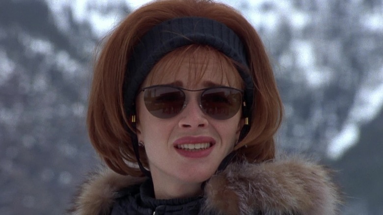 Mary Swanson in sunglasses and a fur coat