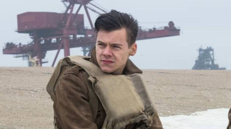 Alex seated on Dunkirk beach