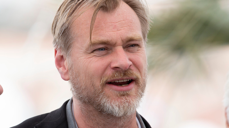 Christopher Nolan smiling at premiere