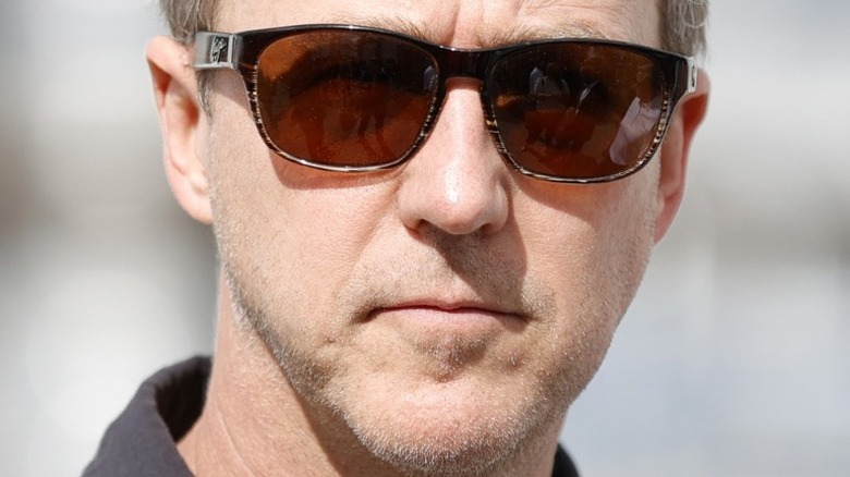 Edward Norton stares behind sunglasses