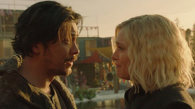 Crying Eliza Taylor and Bob Morley stare at each other