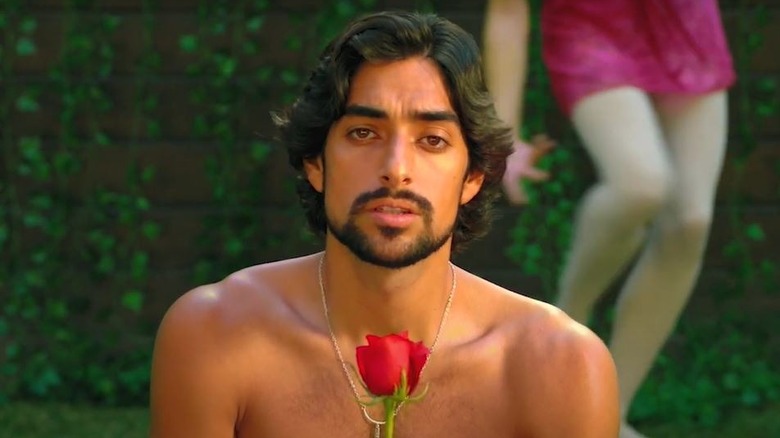 Eman Esfandi holding a rose