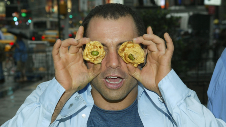 Fear Factor host Joe Rogan poses at an event