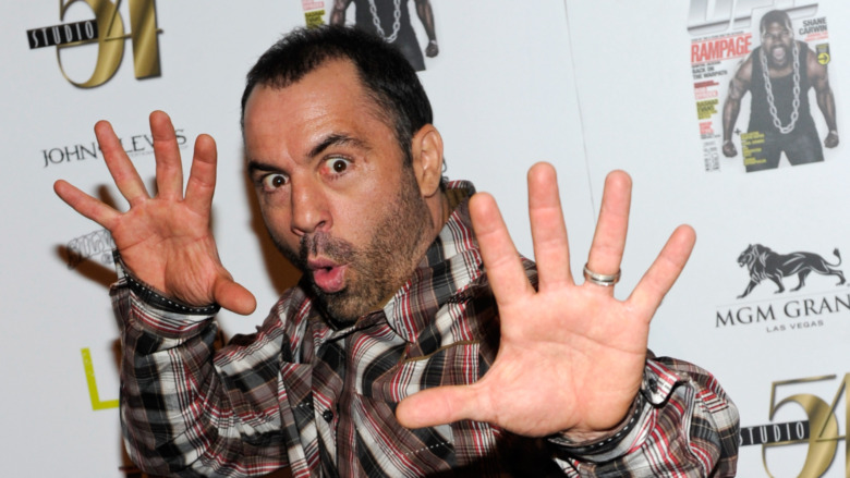 Joe Rogan poses at an event