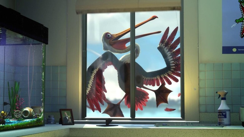 Pelican flattened against window