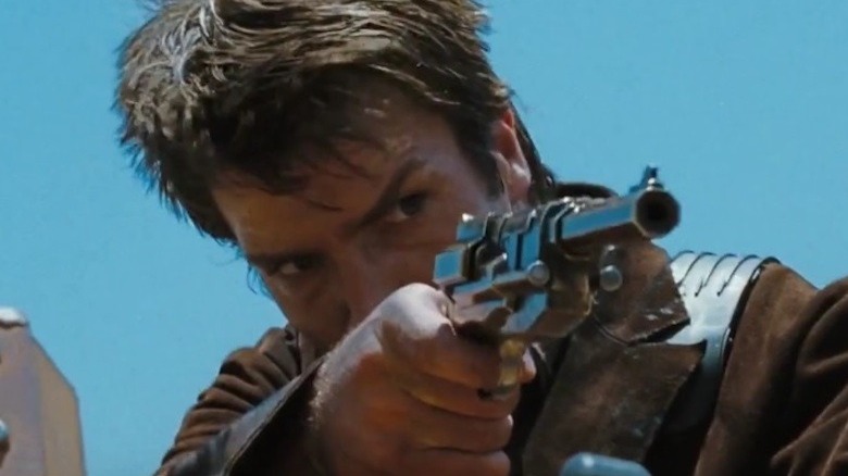 Nathan Fillion holding a gun on Firefly