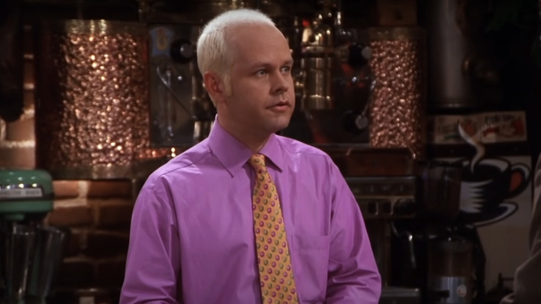 Gunther at Central Perk wearing pink shirt