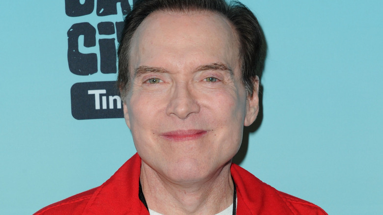 Billy West in red jacket