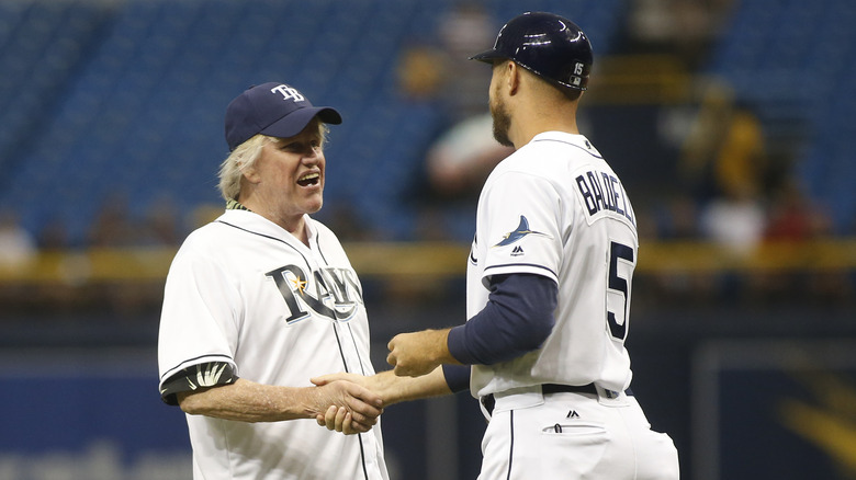 Gary Busey shakes hands with Rocco Baldelli