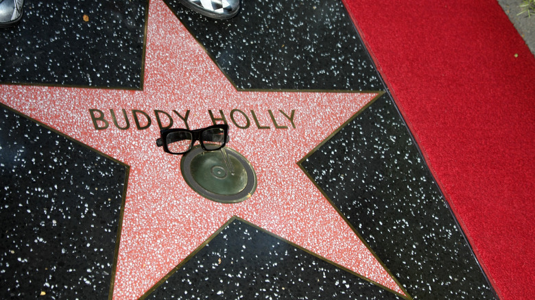 A pair of glasses rests in tribute on Buddy Holly's star at the Hollywood Walk of Fame