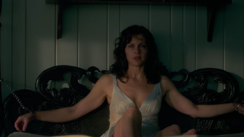 Gugino sitting up handcuffed to bed 