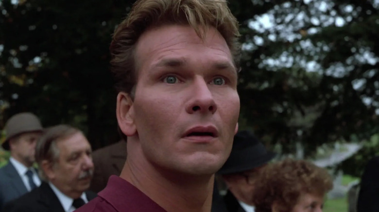 Patrick Swayze looks up at funeral