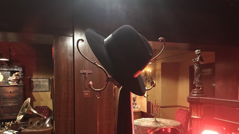 Terry Pratchett's fedora and scarf hanging