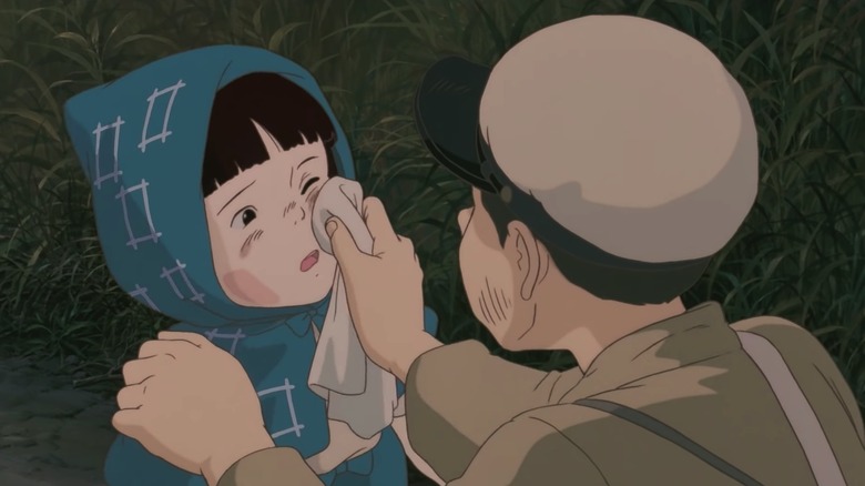 Seita wiping Setsuka's face with cloth