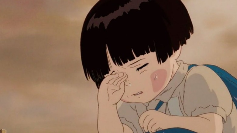 Setsuko crouched and wiping tears