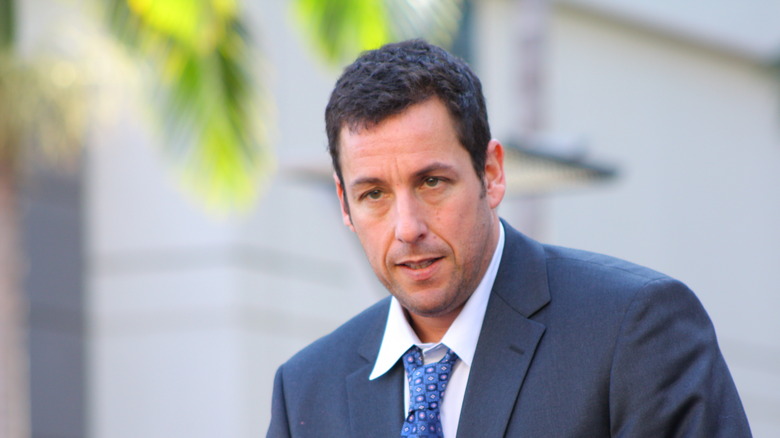 Adam Sandler wearing a suit