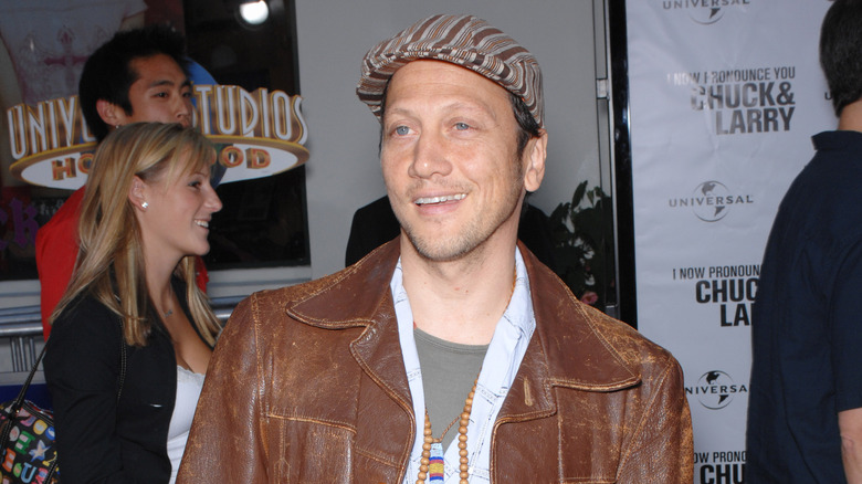 Rob Schneider wearing a hat