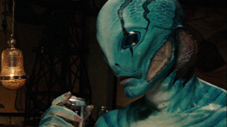 Abe Sapien holding beer