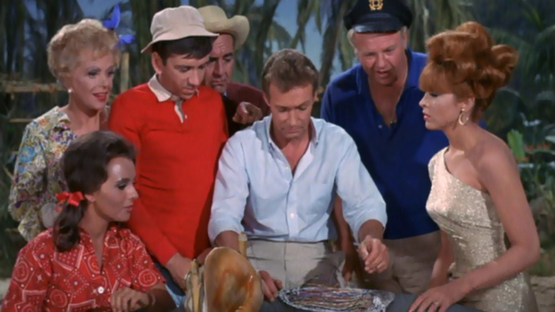 The castaways around a table