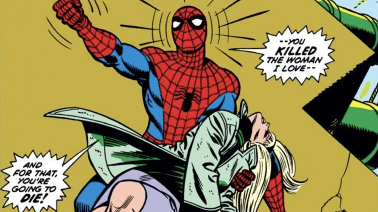 Spider-Man holding Gwen Stacy's dead body 