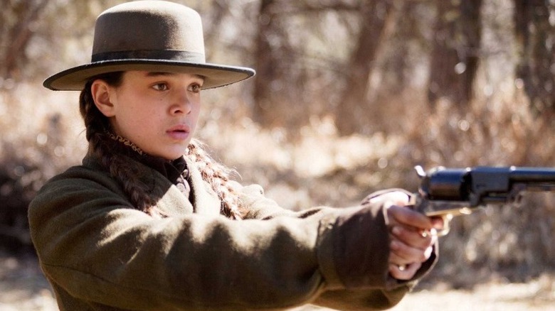 Hailee Steinfeld in True Grit, holding weapon