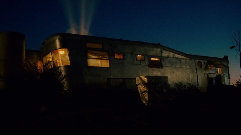 Trailer home with three holes blasted in roof