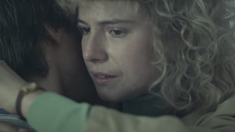 Jessie Buckley as Lyudmila Ignatenko hugging