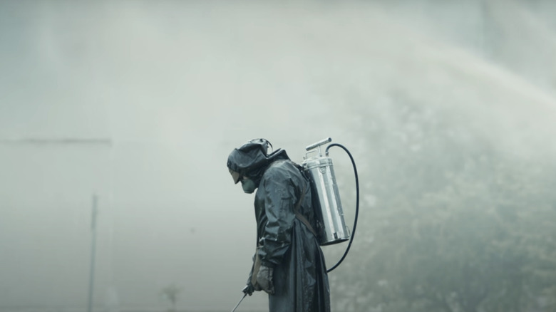 Man in hazmat suit cleaning up Chernobyl