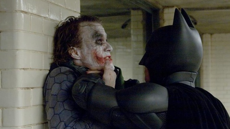 The Dark Knight Batman interrogating Joker