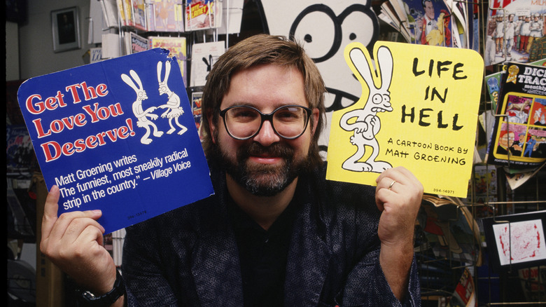 Matt Groening holding books