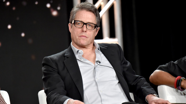 Hugh Grant wearing glasses