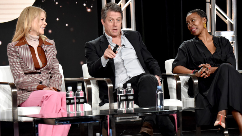 Hugh Grant sitting in a panel