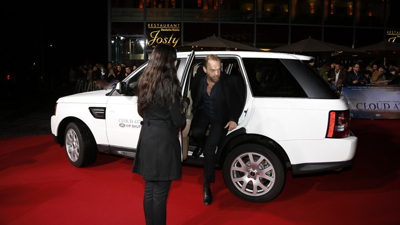 Hugo Weaving getting out of a car