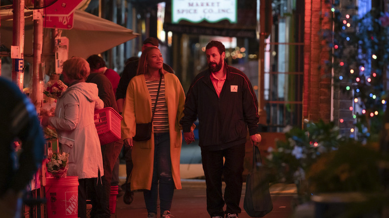 Couple walking and holding hands outside