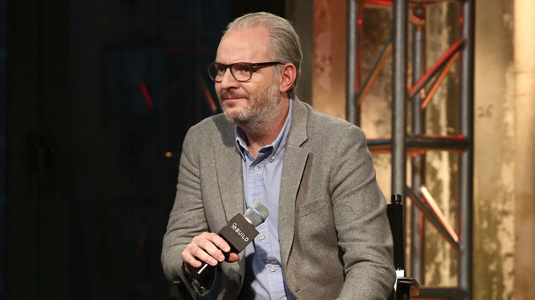 Francis Lawrence holds microphones