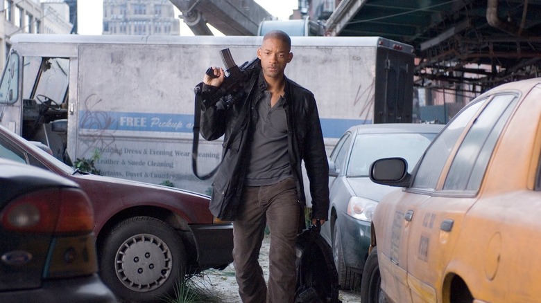 Will Smith walks with gun