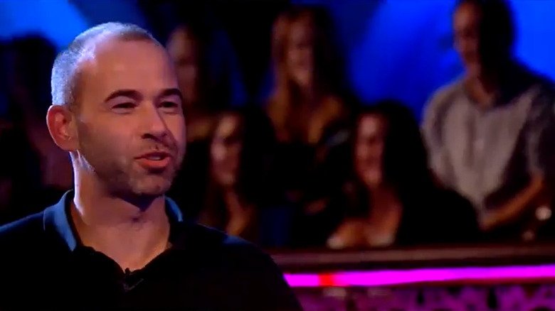 Murr speaking on a stage