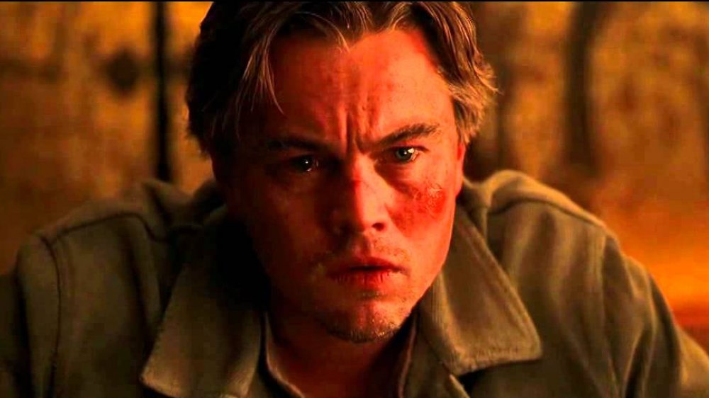 Leonardo DiCaprio as a pretty beaten up-looking Cobb at the end of Inception