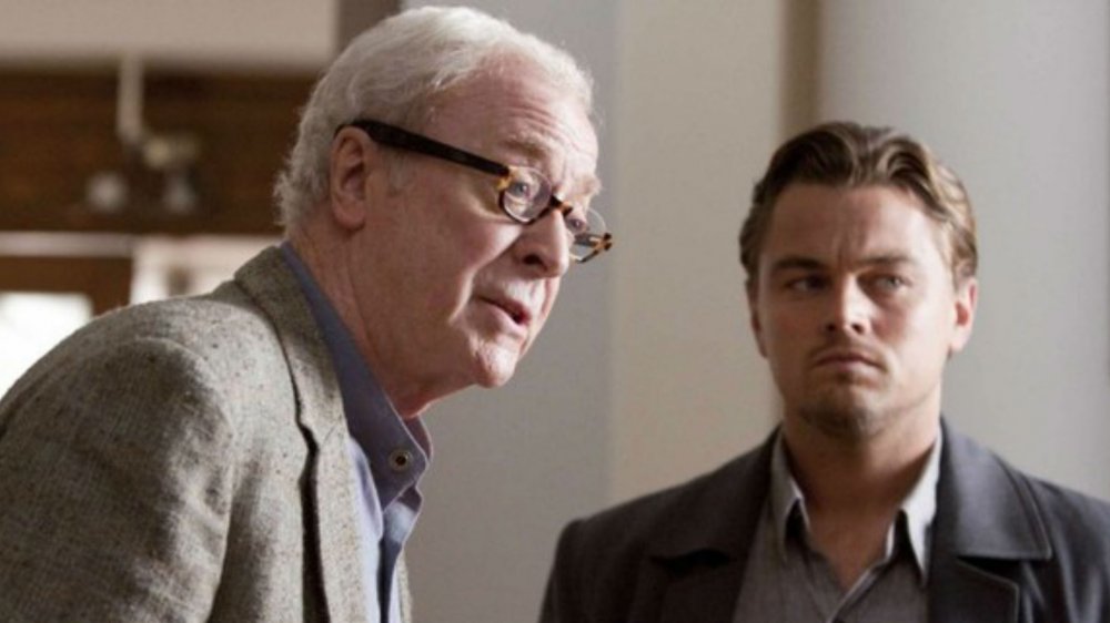 Michael Caine as Stephen Miles and Leonardo DiCaprio as Cobb look serious in Inception