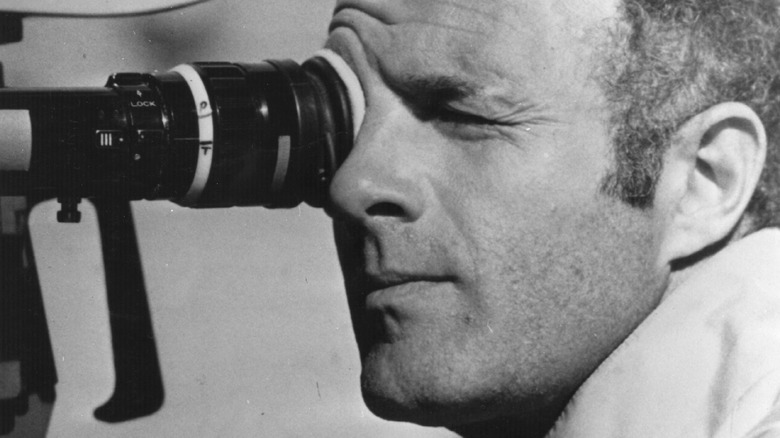 James Caan looking through a film camera