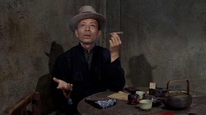 James Hong holding cigar