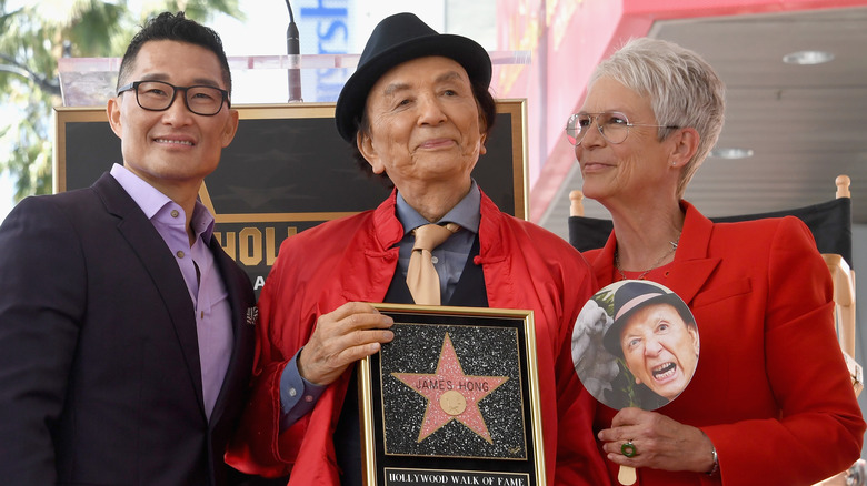 Daniel Day Kim and Jamie Lee Curtis presenting James Hong with a plaque