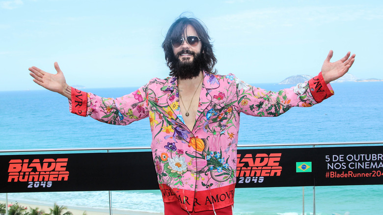 Jared Leto with his arms open wide